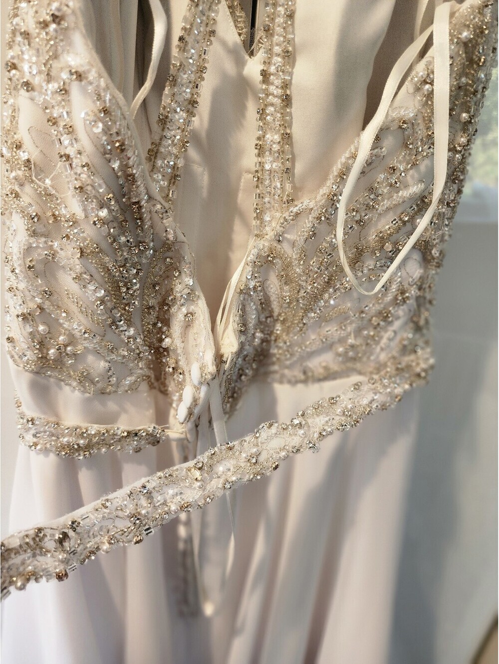 Elegant White Beaded Evening Gown with Sheer Embellished Bodice and Flowing Skit - Picture 4 of 9